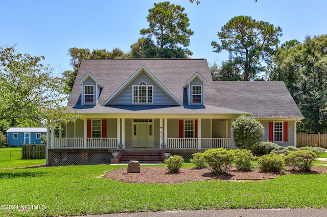 view of front of house featuring a front lawn and a porch