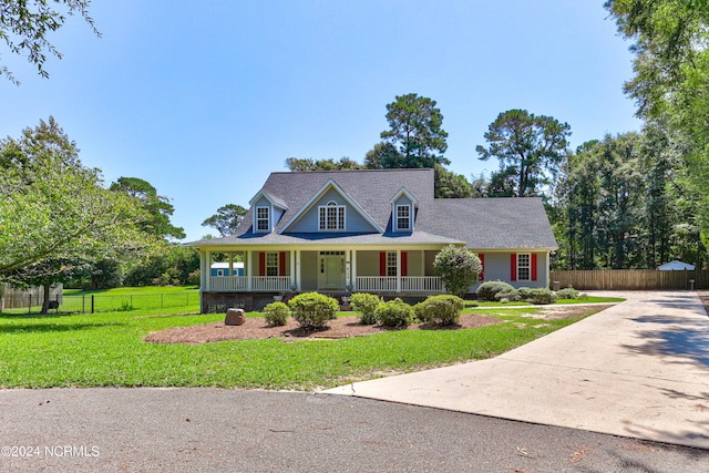 view of front of home with a porch and a front lawn