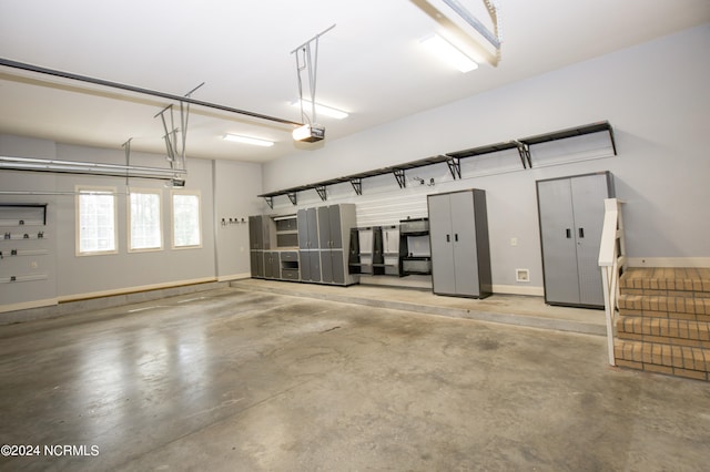 garage featuring baseboards and a garage door opener