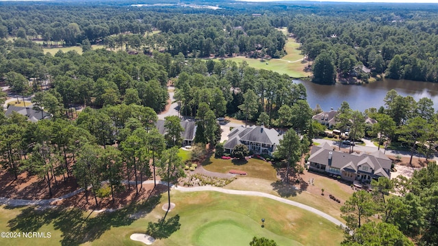 bird's eye view featuring view of golf course, a water view, and a wooded view