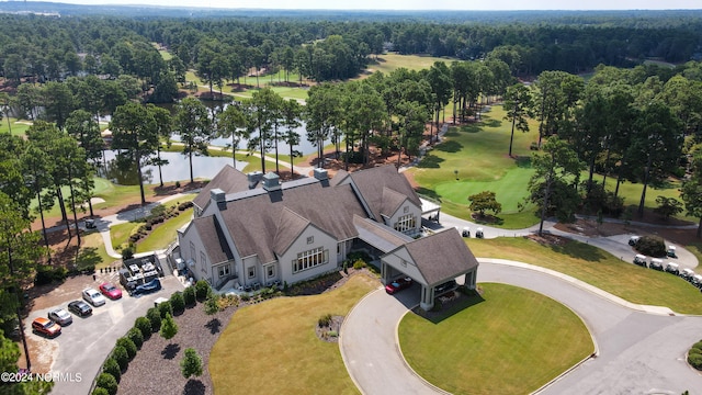 aerial view featuring a view of trees and golf course view