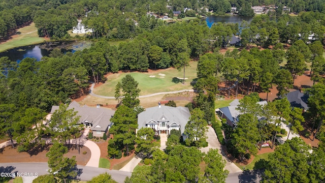 aerial view with view of golf course and a water view