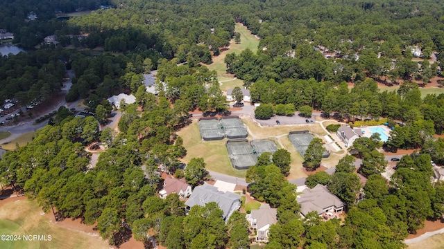 aerial view featuring a wooded view