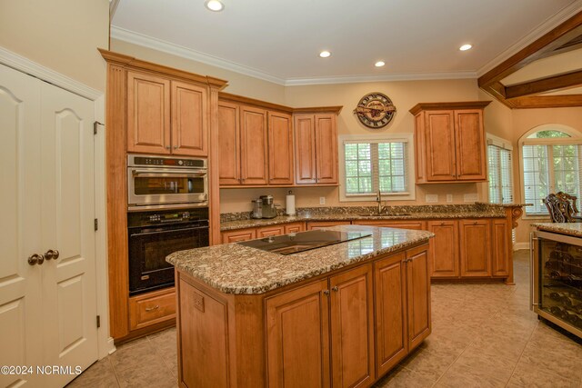 119 Saint Mellions Dr, Pinehurst, NC 28374 - kitchen with a wealth of natural light, a center island, black electric stovetop, and stainless steel double oven