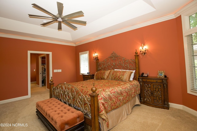 119 Saint Mellions Dr, Pinehurst, NC 28374 - carpeted bedroom with ornamental molding, baseboards, a raised ceiling, and ceiling fan