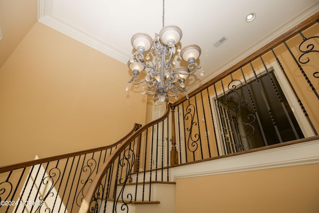 staircase with a chandelier, ornamental molding, visible vents, and recessed lighting