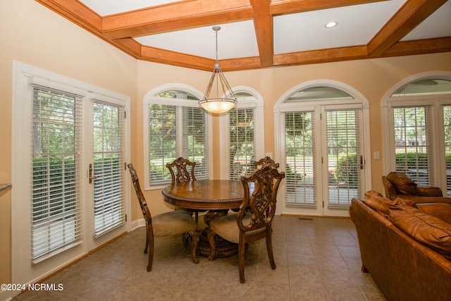 dining space with coffered ceiling, beamed ceiling, and tile patterned floors