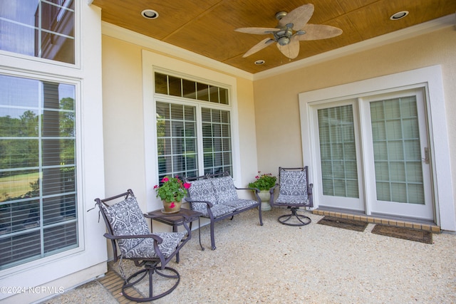 view of patio / terrace with ceiling fan and a porch