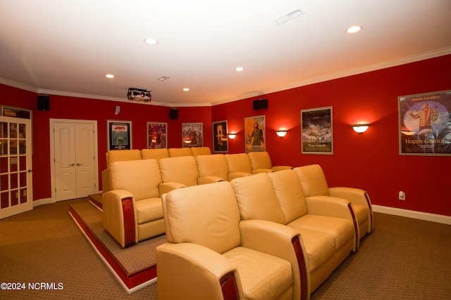 home theater room featuring baseboards, recessed lighting, carpet, and crown molding