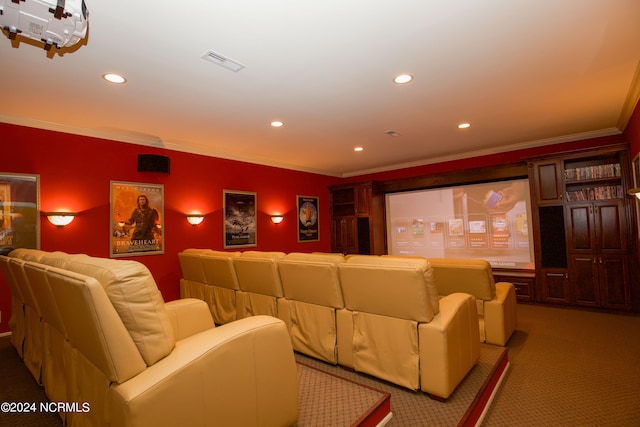 cinema room featuring light carpet, recessed lighting, visible vents, and ornamental molding