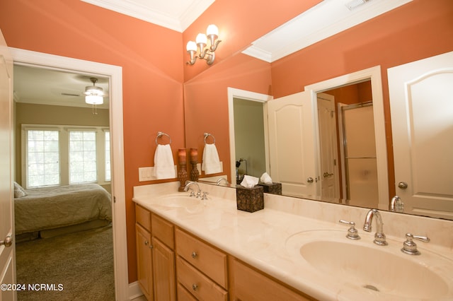 bathroom with double vanity, ornamental molding, ensuite bath, and a sink