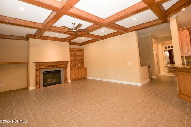 119 Saint Mellions Dr, Pinehurst, NC 28374 - unfurnished living room with ceiling fan, a glass covered fireplace, coffered ceiling, baseboards, and beam ceiling