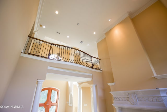 stairs featuring ornamental molding, recessed lighting, and decorative columns