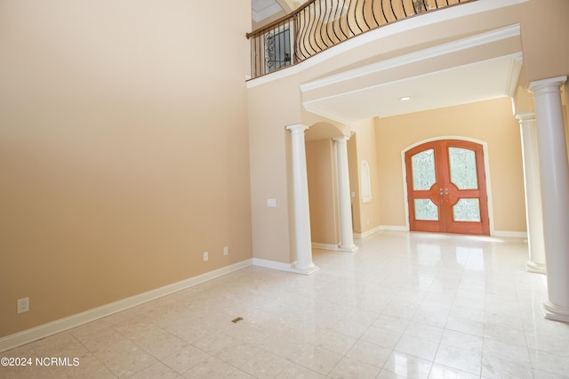 119 Saint Mellions Dr, Pinehurst, NC 28374 - foyer entrance featuring a towering ceiling, french doors, ornate columns, and baseboards
