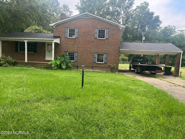 split level home with a carport and a front lawn