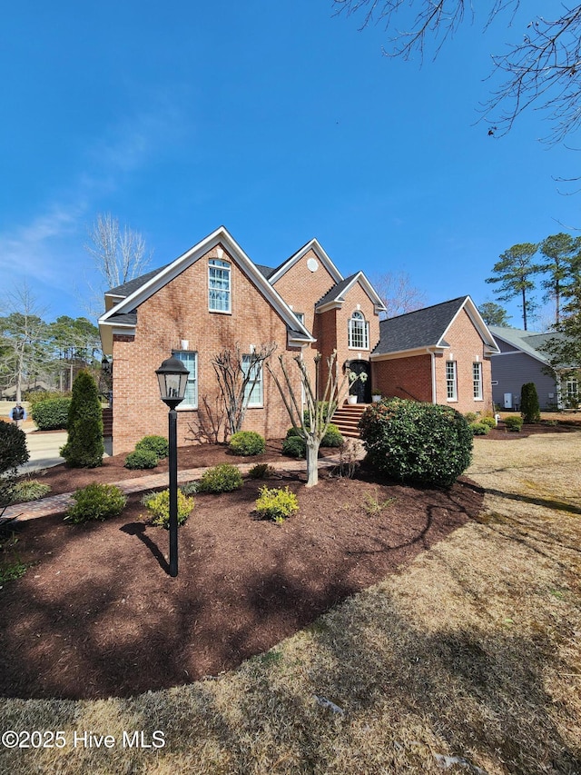 view of front of property with brick siding