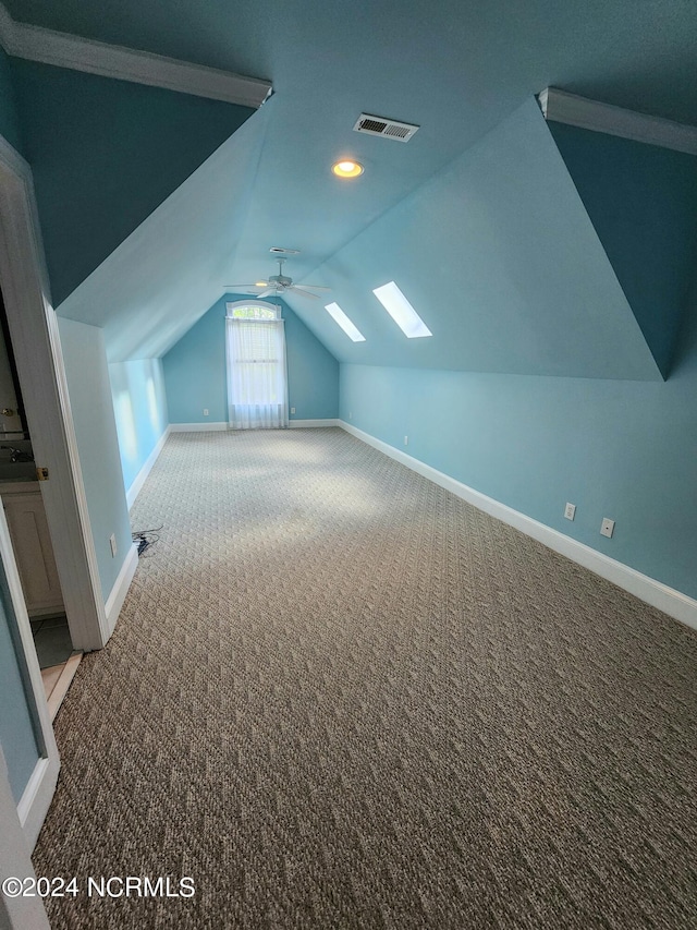 additional living space featuring visible vents, baseboards, and carpet