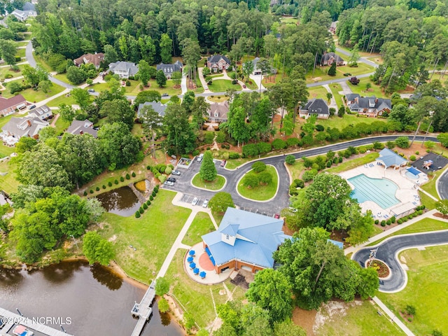 bird's eye view featuring a water view and a residential view