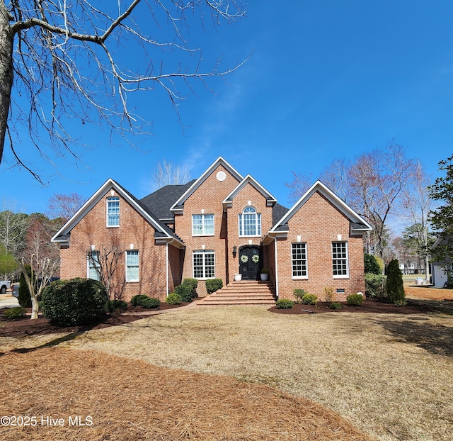 traditional-style house with brick siding