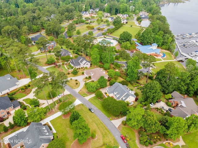 birds eye view of property with a water view and a residential view