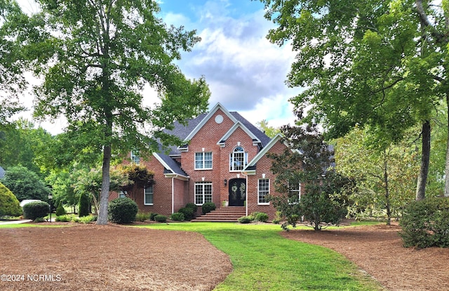 view of exterior entry with a patio