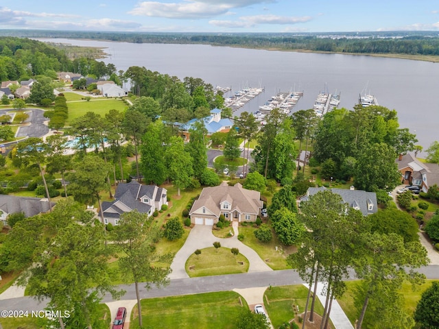 drone / aerial view featuring a water view and a residential view