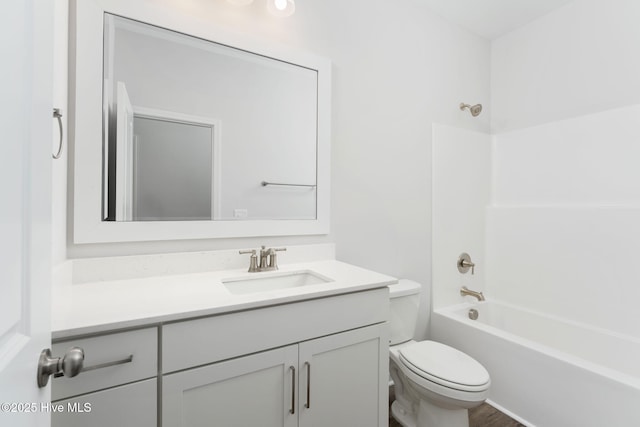 full bathroom with vanity, tub / shower combination, and toilet