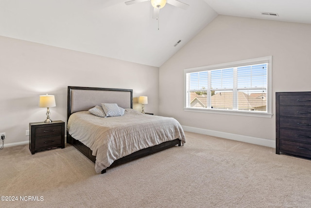 bedroom with light carpet, high vaulted ceiling, and ceiling fan