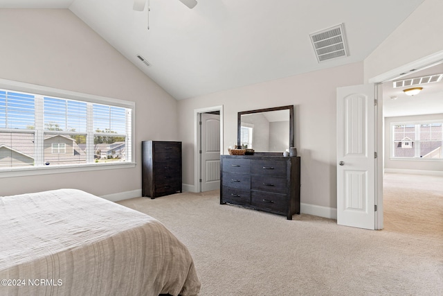 bedroom featuring light carpet, high vaulted ceiling, and ceiling fan