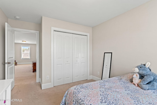 carpeted bedroom featuring a closet