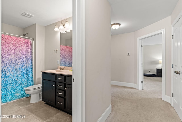 bathroom with vanity, toilet, and a shower with curtain