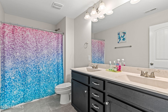 bathroom featuring vanity, toilet, a shower with shower curtain, and tile patterned flooring