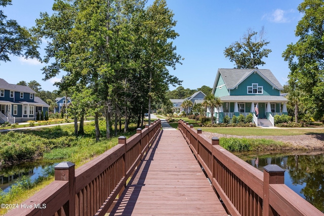 view of community with a water view