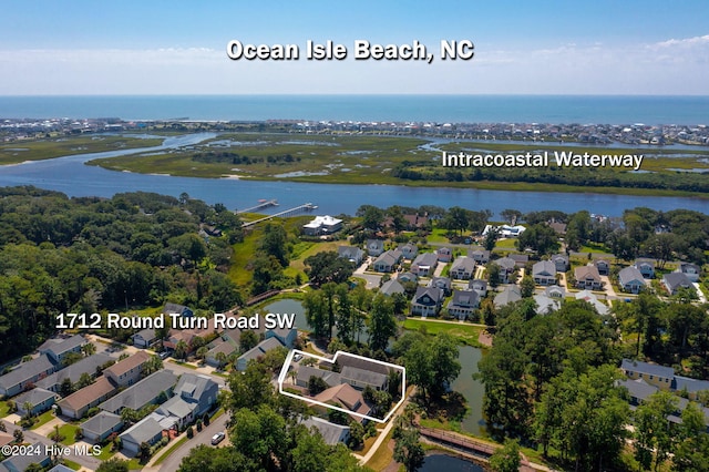 aerial view featuring a water view and a residential view