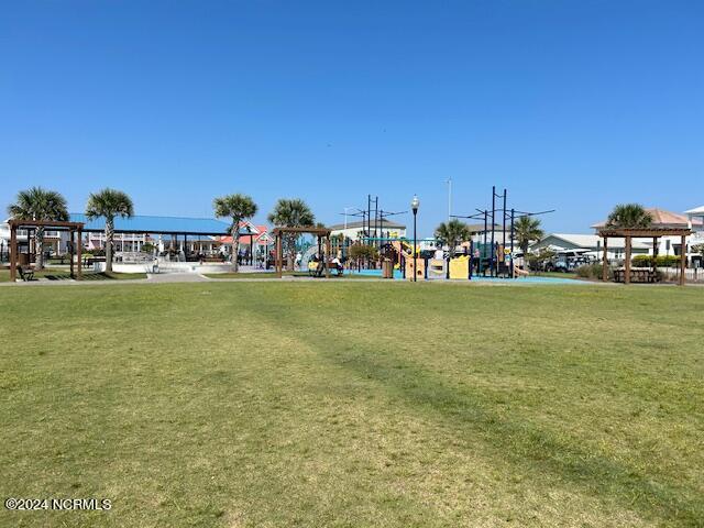 surrounding community featuring a gazebo and a lawn