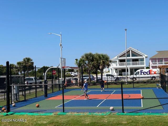 view of sport court with community basketball court and fence