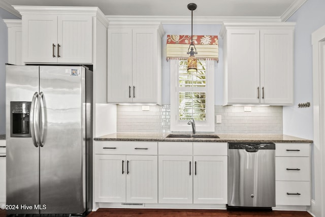 kitchen featuring appliances with stainless steel finishes, sink, and white cabinets