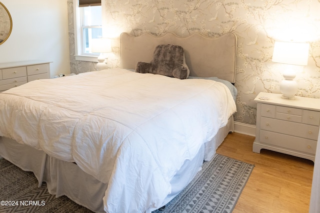 bedroom with light hardwood / wood-style flooring