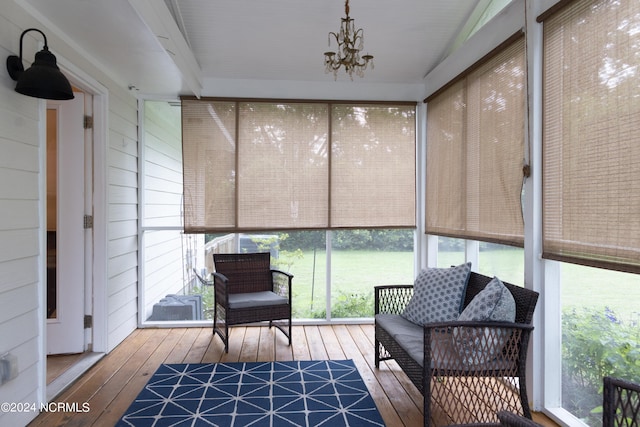 sunroom with a chandelier