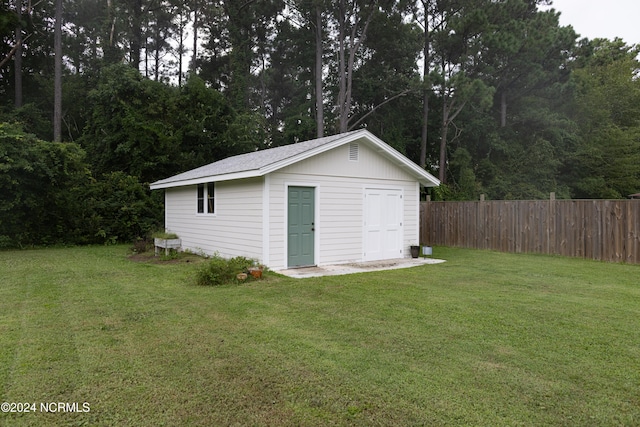 view of outdoor structure with a lawn