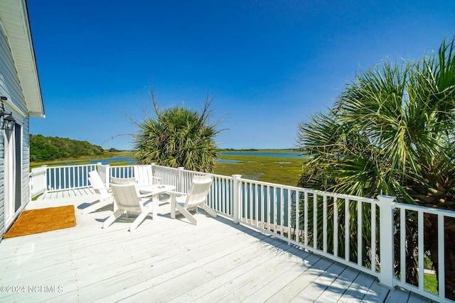 deck featuring a water view