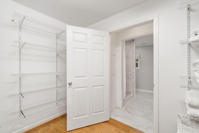 walk in closet featuring wood-type flooring