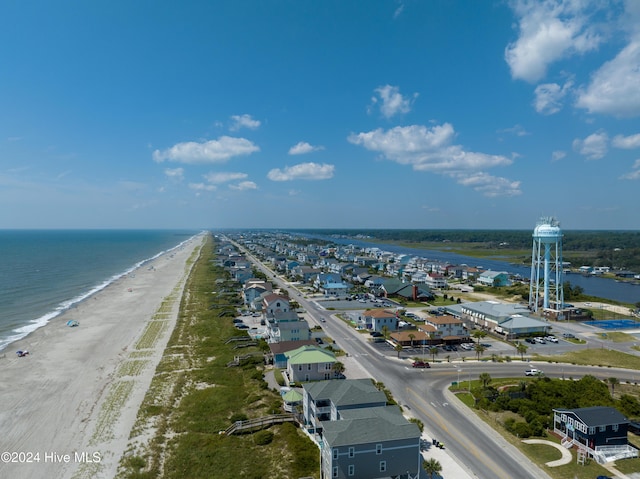 drone / aerial view with a beach view and a water view