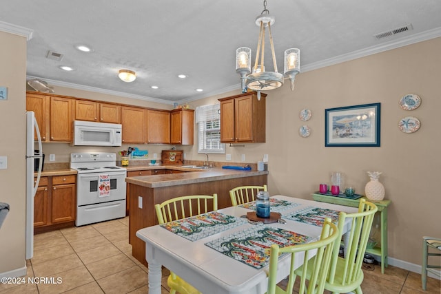 kitchen with ornamental molding, white appliances, and visible vents