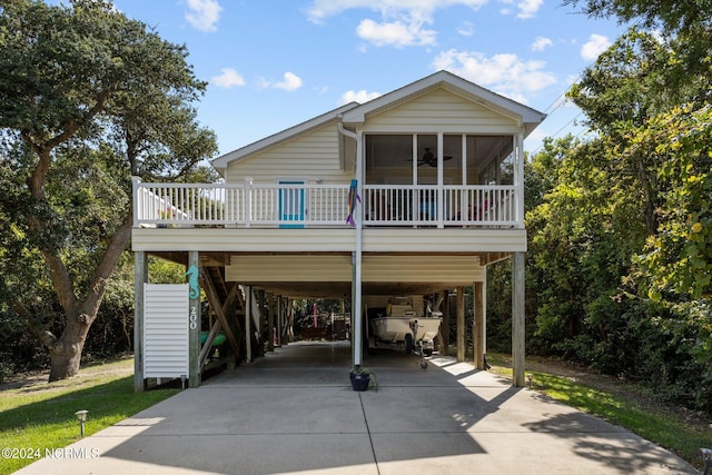 exterior space featuring a sunroom and a carport