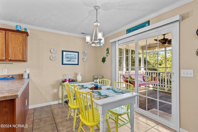 dining area with visible vents, baseboards, light tile patterned flooring, crown molding, and ceiling fan with notable chandelier