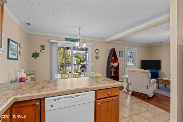 kitchen with light tile patterned floors, light countertops, white dishwasher, a chandelier, and a peninsula