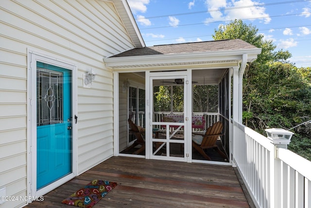 wooden terrace with a sunroom