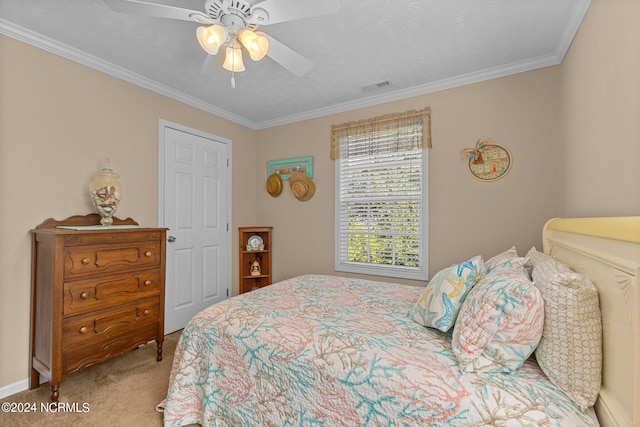 bedroom featuring carpet floors, visible vents, a textured ceiling, and ornamental molding