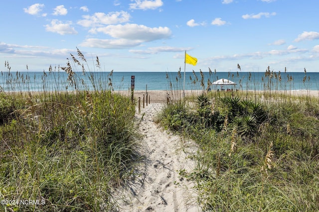 property view of water featuring a beach view